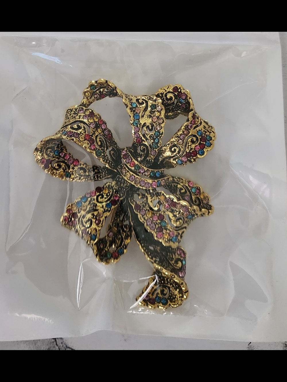 Gold-tone Bow Brooch with Multicolored Rhinestones